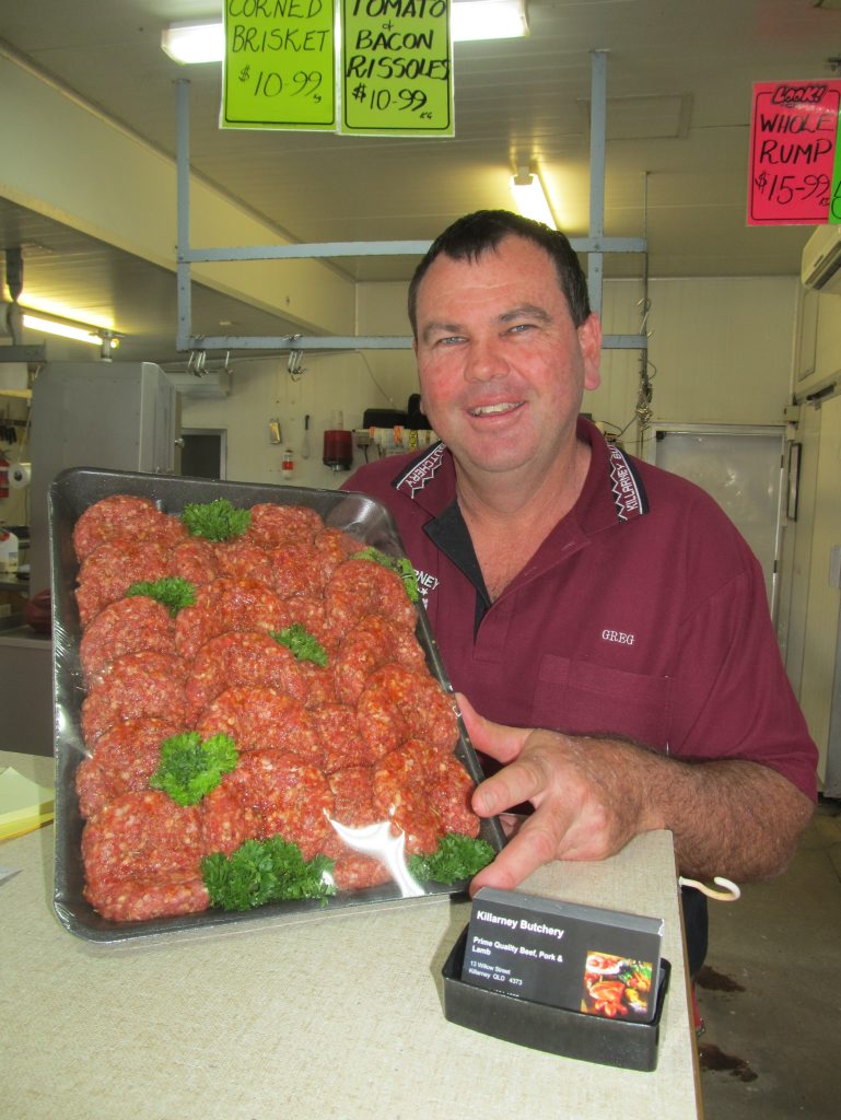 Killarney Butchery owner, Greg Power, with a tray of premium lamb rissoles in readiness for Australia Day. Photo Contributed